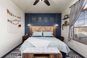 Primary bedroom with a beautiful feature wall.