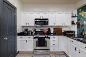 Sale includes the stainless steel appliances.