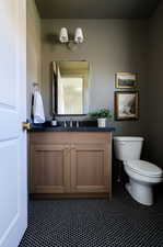 Half bath with vanity and toilet off the mudroom