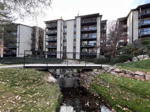 Picturesque views of mountains, slow moving stream, foot path bridges, and wood view