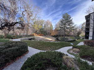 Picturesque views of mountains, slow moving stream, foot path bridges, and wood view