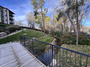 Picturesque views of mountains, slow moving stream, foot path bridges, and wood view