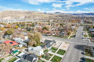 Aerial view of property's location with mountains and nearby suburban area