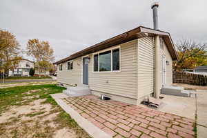 View of front facade featuring a patio area and entry steps