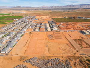 Aerial overview of property's location with a mountainous background