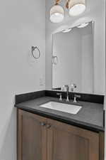 Half bath with vanity off of main level garage