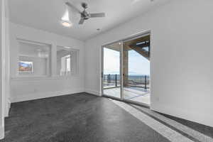 Exercise room featuring rubber mat flooring, door to back deck by pool / spa area, windows looking into sports court, valley and mountain views