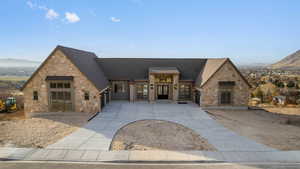 View of front facade with a mountain view and stone siding