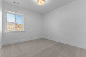 Carpeted bedroom featuring a mountain view