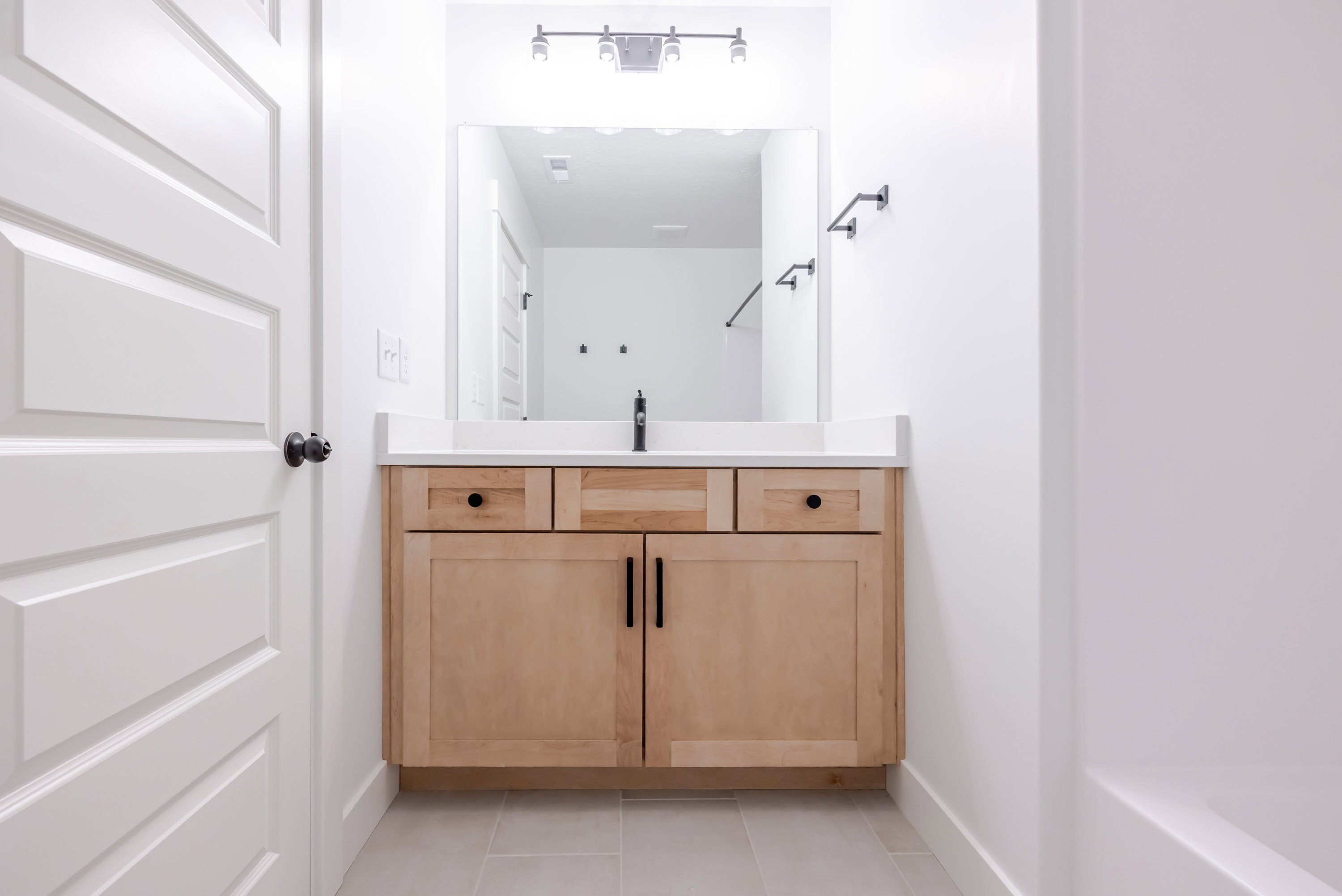 Bathroom featuring vanity and light tile patterned flooring