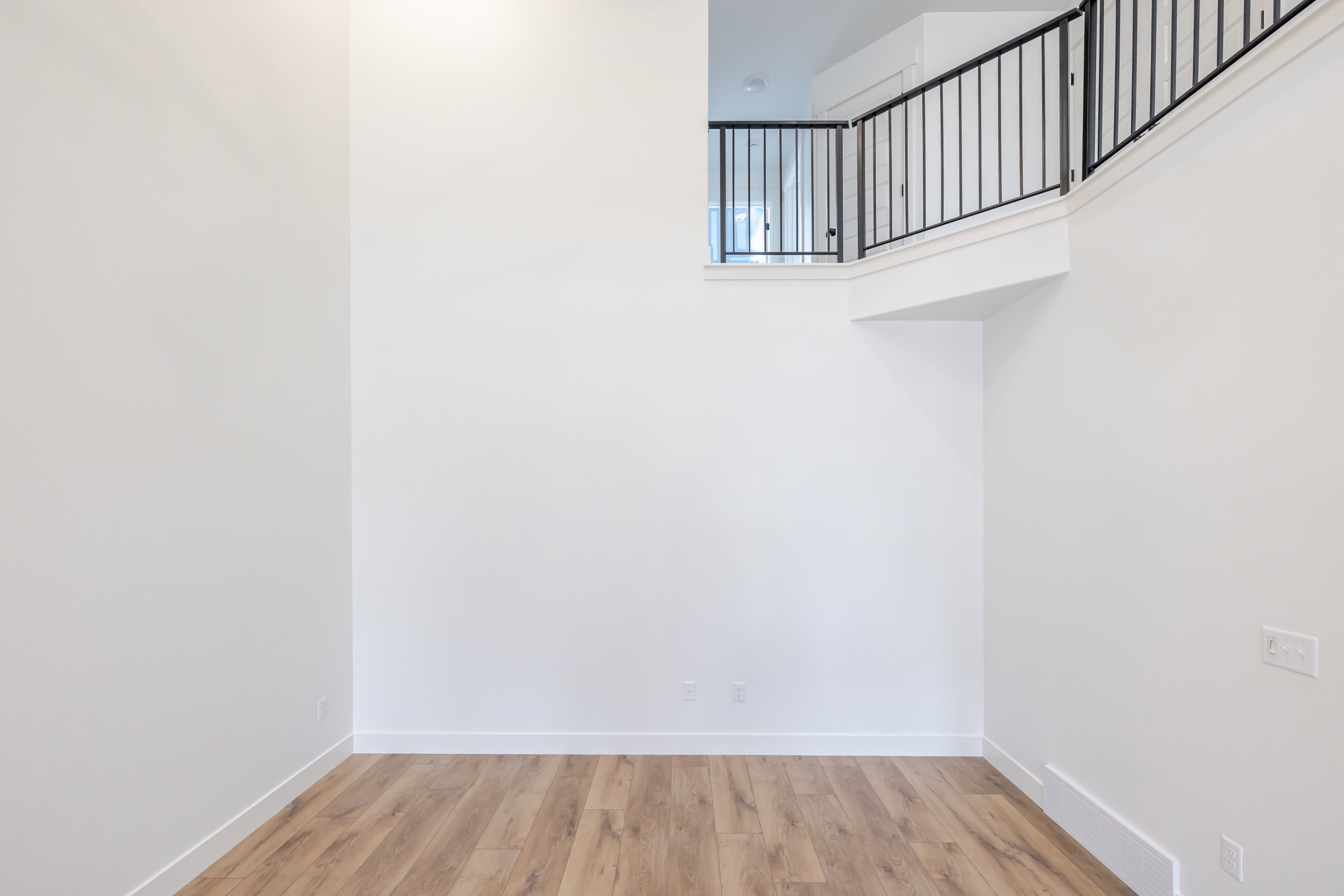 Unfurnished room featuring light wood-style flooring and baseboards