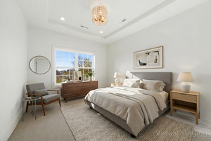 Bedroom featuring carpet flooring, a tray ceiling, and recessed lighting
