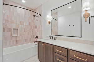 Full bath featuring vanity, bathtub / shower combination, and recessed lighting
