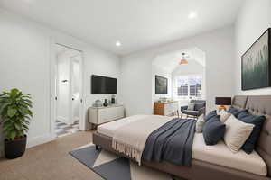 Bedroom featuring carpet, vaulted ceiling, recessed lighting, and ensuite bath
