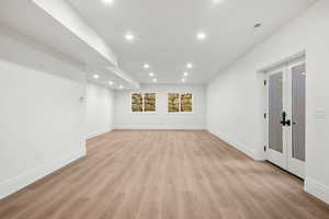 Unfurnished room with french doors, recessed lighting, and light wood finished floors