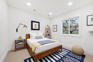 Bedroom featuring light colored carpet and recessed lighting
