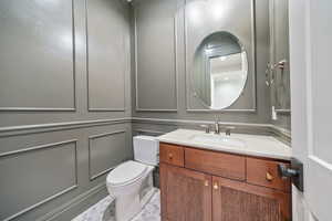 Bathroom featuring vanity and toilet