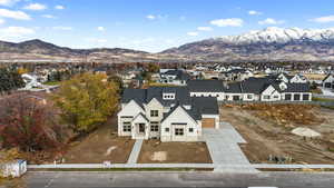 Aerial perspective of suburban area with a mountain backdrop