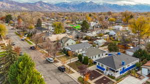 Aerial view of residential area featuring a mountainous background