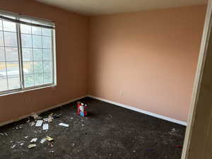 Spare room featuring baseboards