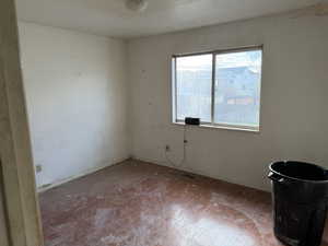 Unfurnished room featuring baseboards