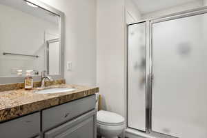Bathroom with vanity and a stall shower