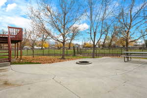 View of patio / terrace featuring a fire pit and a view of rural / pastoral area