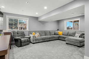 Carpeted living room featuring recessed lighting