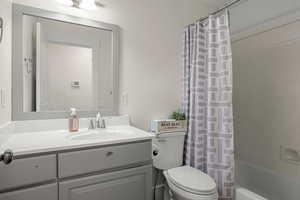 Bathroom featuring vanity and shower / bath combo