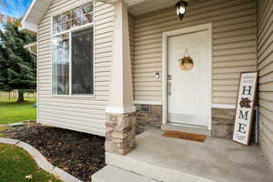 Property entrance featuring covered porch