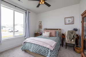 Bedroom featuring carpet and ceiling fan