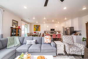 Living room featuring recessed lighting, wood finished floors, and a ceiling fan