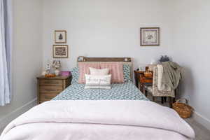 Bedroom featuring baseboards