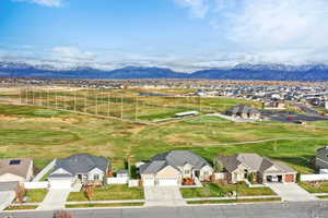 Aerial perspective of suburban area with a mountainous background
