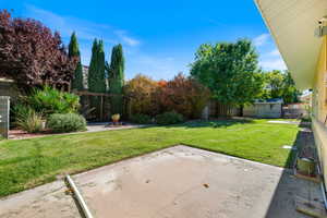 Fenced backyard featuring a patio area