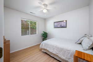 Bedroom featuring wood finished floors and ceiling fan