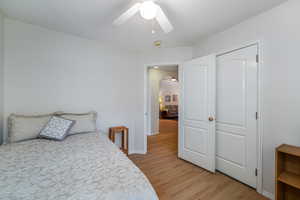 Bedroom featuring light wood-type flooring and ceiling fan