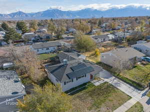 Aerial perspective of suburban area with a mountain backdrop