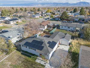 Aerial view of residential area featuring a mountainous background