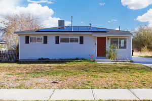 View of front of home with solar panels