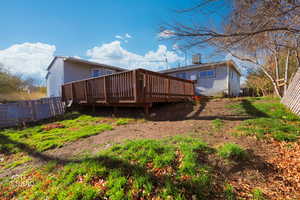 Back of property featuring a deck