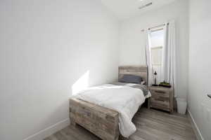Bedroom with wood finished floors