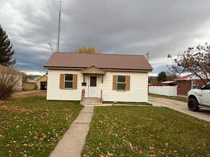 Bungalow-style house featuring a metal roof