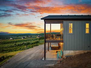 Outdoor structure at dusk with a mountain view