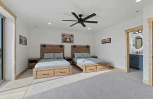 Bedroom featuring recessed lighting, ensuite bath, ceiling fan, and light carpet