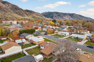 Aerial perspective of neighborhood with a mountain backdrop