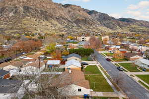 Aerial perspective of neighborhood with a mountain backdrop