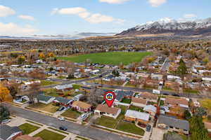 Aerial perspective of neighborhood with a mountain backdrop