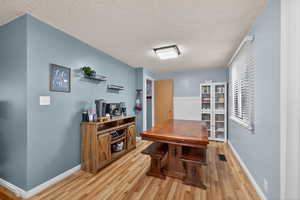 Dining space with light wood-type flooring