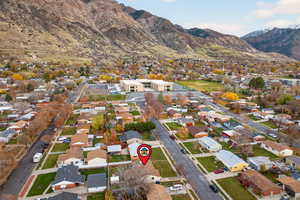 Aerial perspective of neighborhood with a mountain backdrop
